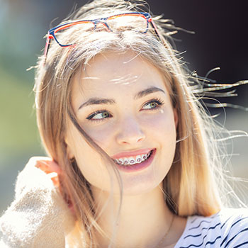 Beautiful Young Blonde Girl Wearing metial braces