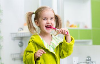 happy girl brushes teeth license confirmed
