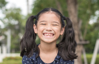 smiling girl in the garden license confirmed